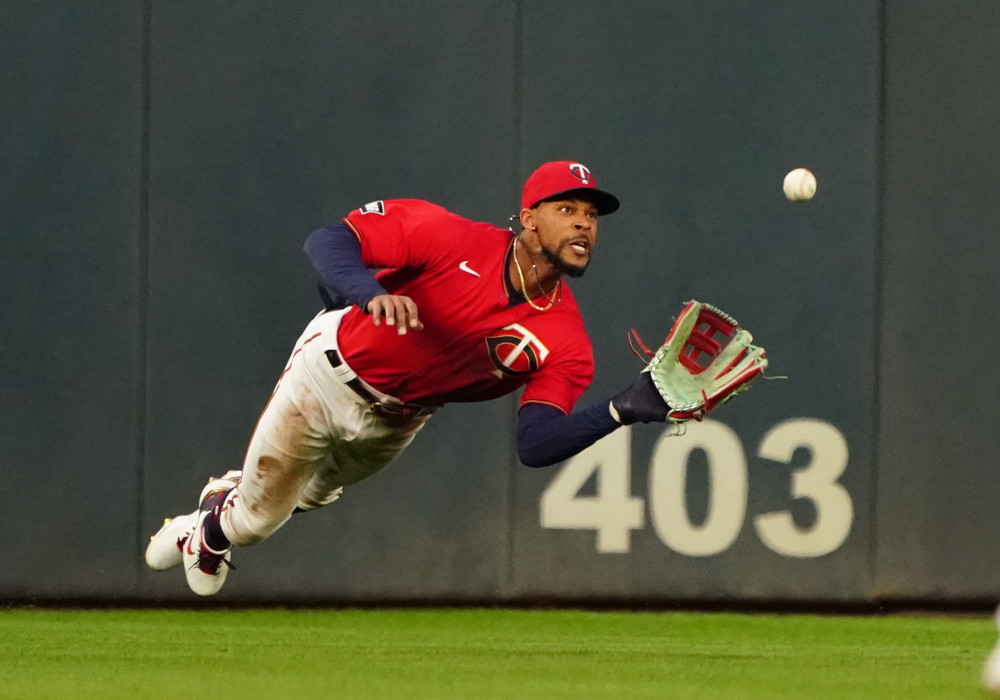 Byron Buxton diving for a fly ball in shallow center field