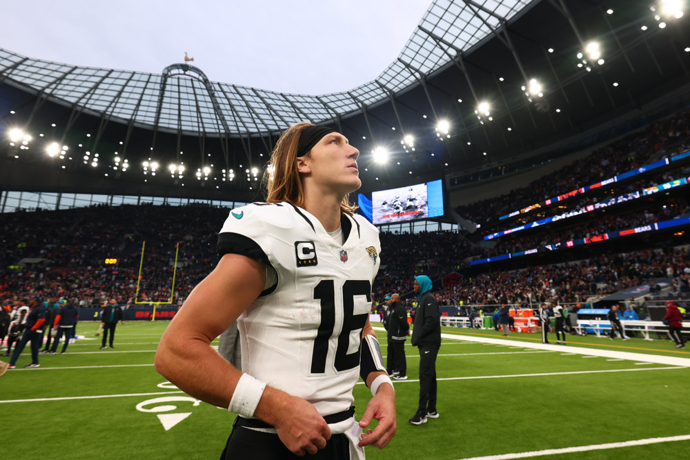 Trevor Lawrence stares outward at the sky after a loss to the Chicago Bears.