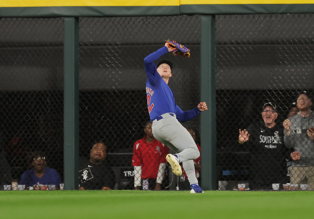 Pete Crow Armstrong retreats to catch a fly ball.