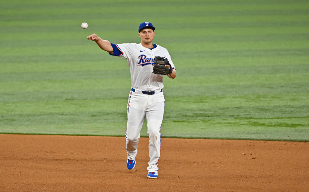 Corey Seager makes a throw from shortstop.