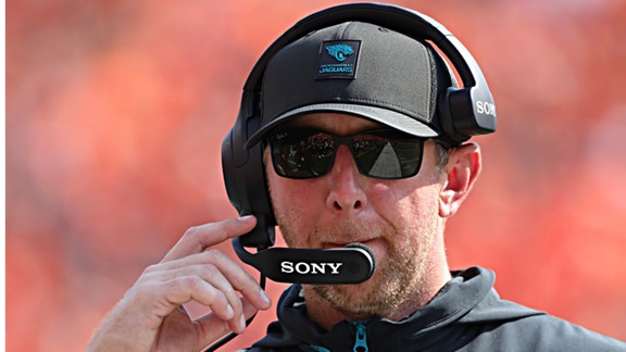 Jaguars head coach Liam Coen listens on his headset.