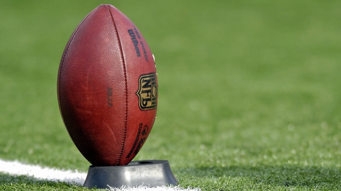 A football rests on a tee