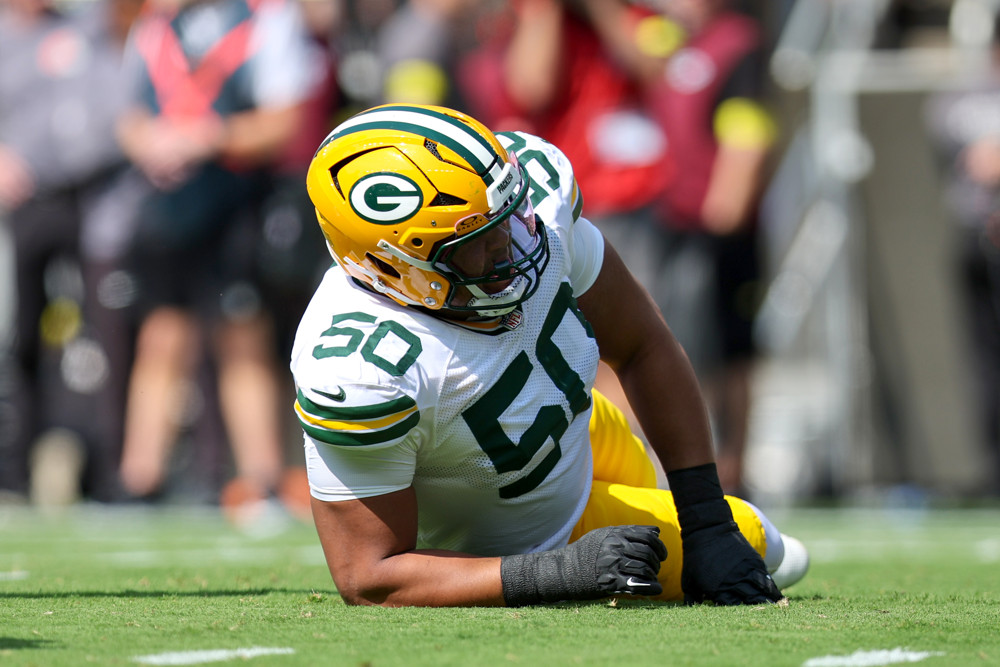Zach Tom of the Packers is partially on his stomach, injured.