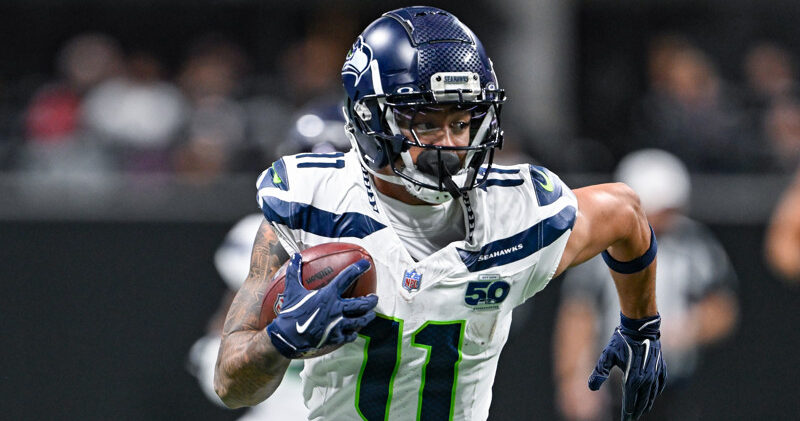 Jalen Duren, wearing a blue Pistons jersey with red No. 8, dunks with his right hand.