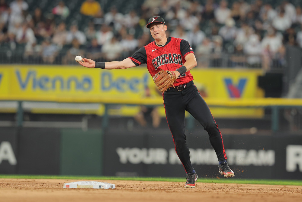 Jalen Duren, wearing a blue Pistons jersey with red No. 8, dunks with his right hand.
