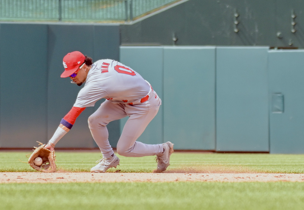 Jalen Duren, wearing a blue Pistons jersey with red No. 8, dunks with his right hand.
