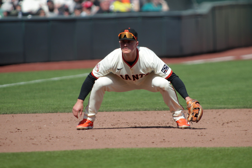 Jalen Duren, wearing a blue Pistons jersey with red No. 8, dunks with his right hand.