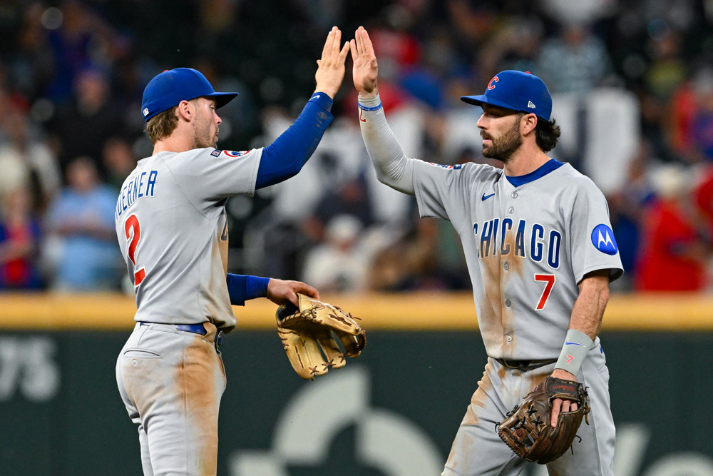 Jalen Duren, wearing a blue Pistons jersey with red No. 8, dunks with his right hand.