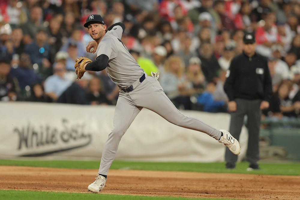 Jalen Duren, wearing a blue Pistons jersey with red No. 8, dunks with his right hand.